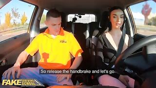 A girl is having fun with her fake driving school teacher in the car
