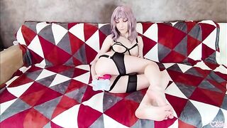 A girl with a cute face plays with a big dildo and squirts