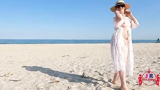 A girl is posing naked and having sex on the public beach for the first time