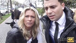 The blonde is having sex with a collector in front of her husband