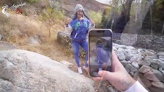 A sexy girl is having fun with her boyfriend in nature after a photo shoot