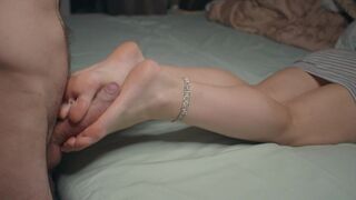 Petite lady shows off small feet and skills in footjob, gets cum on soles