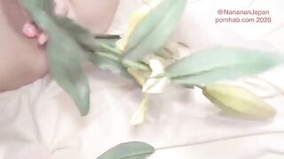 Bukkake while the girl is putting flowers in her ass