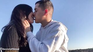 A passionate couple having sex in the public park