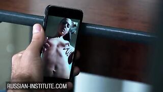 The petite girl warms up her boyfriend with a video call and a toy