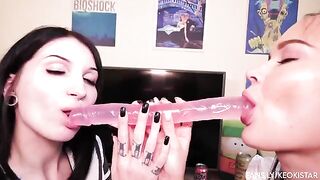 Two girls playing with their wet pussies using a dildo