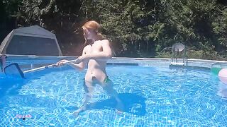 A redhead tries to shoot a video while swimming in the pool, but it doesn’t go as planned
