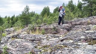 A short-haired beauty gets fucked outdoors on a stony surface, showcasing her wild side