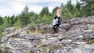 A short-haired beauty gets fucked outdoors on a stony surface, showcasing her wild side