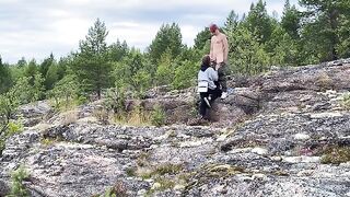 A short-haired beauty gets fucked outdoors on a stony surface, showcasing her wild side