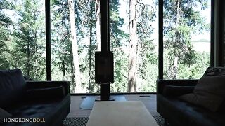 A girl practices yoga alone in the forest, teasing herself