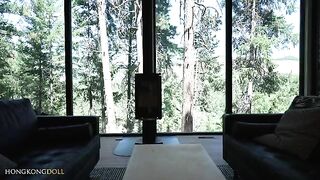A girl practices yoga alone in the forest, teasing herself