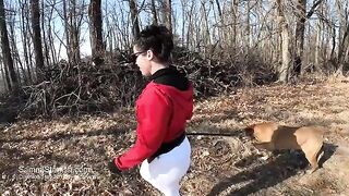 A sexy woman shows her ass in yoga pants outdoors