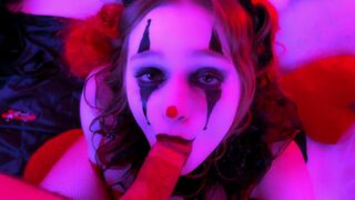 The man with a mask of a clown makes cum on her face
