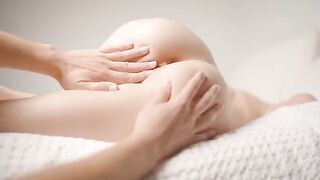 The guy gently caresses her pussy with his fingers during a relaxing massage
