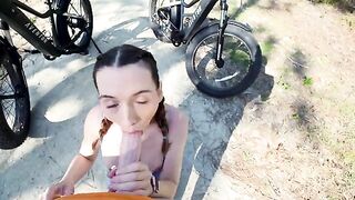 Petite brunette takes a big dick tourist on a thrilling bike ride through the forest