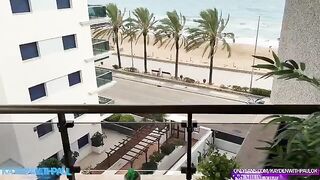 A couple engaged in sex on the balcony while the sea view