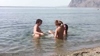 Three naked girls on the beach with a crest each, erporn style