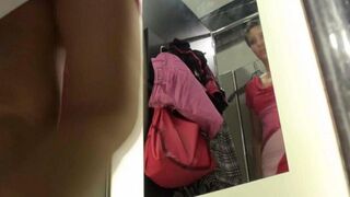The cunning peeping guy spied on a sexy girl in the locker room of the store