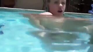 Girl has anal sex using a dildo while in the swimming pool