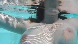 Girl masturbating with a dildo in the swimming pool