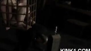 A slave in a cage is at the master's command