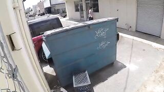 A naked chick was photographed having sex behind a garbage tank