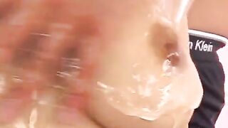 Hot Japanese chick rubs her boobies with oil and masturbates