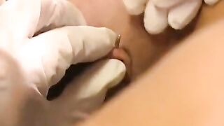 Girl with a pierced clitoris plays with sex toys