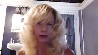 A aged woman caresses herself in the bathroom