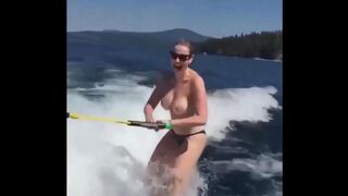 Topless girl skiing on water, a thrilling sight!