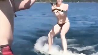Topless girl skiing on water, a thrilling sight!