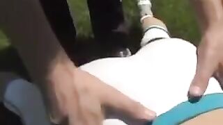 A busty brunette woman gets a cumshot on her tits