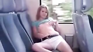 Lifting the skirt on the bus and ironing the pussy through panties