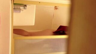 A girl has sex in the shower and is filmed