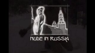Nude girls are having fun with snowballs on the city streets