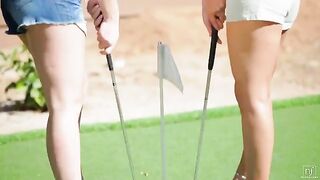 The beautiful woman is lost in lesbian sex on the golf course