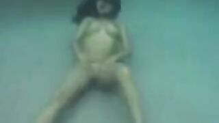 Underwater sex with a busty brunette in the ocean full of pleasure