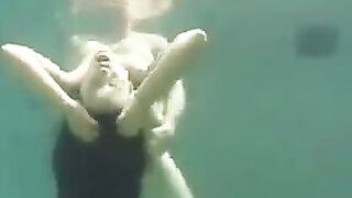 Underwater sex with a busty brunette in the ocean full of pleasure