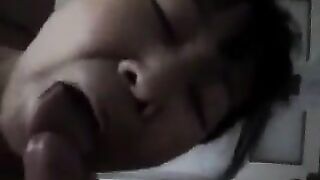 A Chinese woman practices her blowjob skills on him