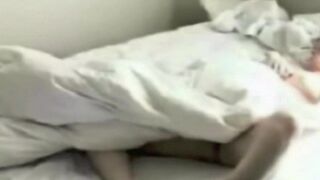 A guy masturbates in the bedroom, unaware of the hidden camera