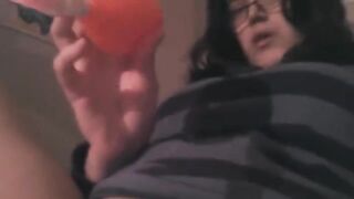 A hot brunette gets her clitoris stimulated with a vibrator on the bed