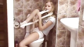 Blonde surprises the public toilet with a striptease that's simply daring