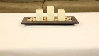 Under the table, Chloe Amur jerks her client's cock during a massage