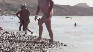 A hot nudist is walking on the beautiful coast of Crimea