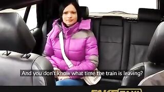 A hot girl is having fun with her taxi driver in the car