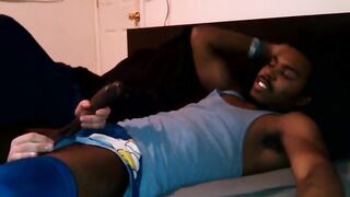 A black chick with porn actress makes a blowjob on the bed