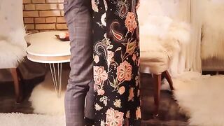 A girl in a long black dress has passionate sex with her lover