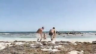 Blonde is fucking on the beach with two guys