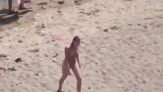 A pair of naturists swim naked in the sea, enjoying freedom